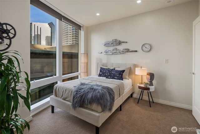 bedroom with recessed lighting, carpet flooring, and baseboards