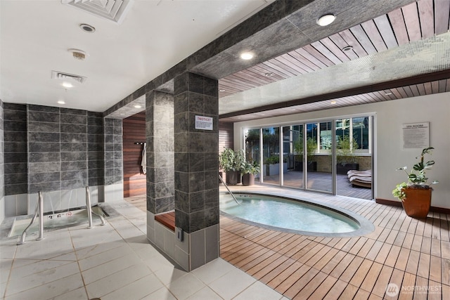 view of pool featuring a jacuzzi