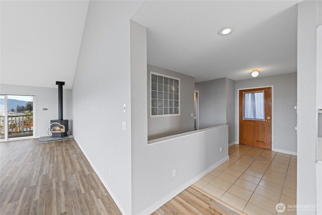 interior space featuring baseboards and wood finished floors