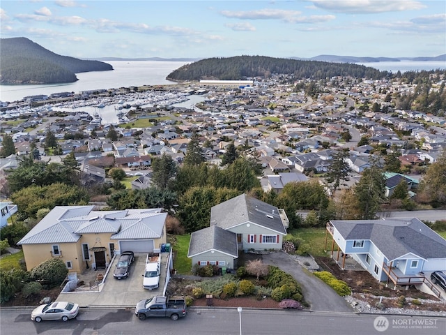 aerial view featuring a water view and a residential view