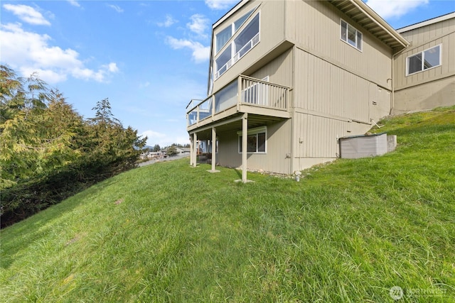 rear view of property with a lawn