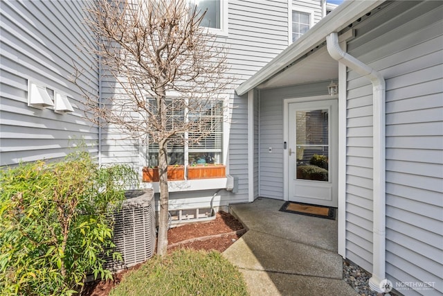 entrance to property featuring central AC unit