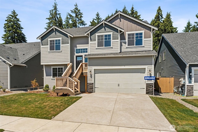 view of front facade featuring driveway, stone siding, an attached garage, board and batten siding, and a front yard