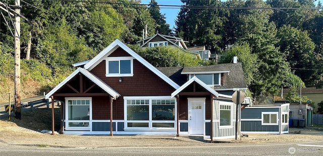 view of front facade with a shingled roof