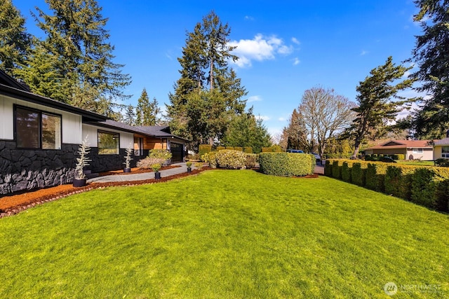 view of yard featuring an attached garage