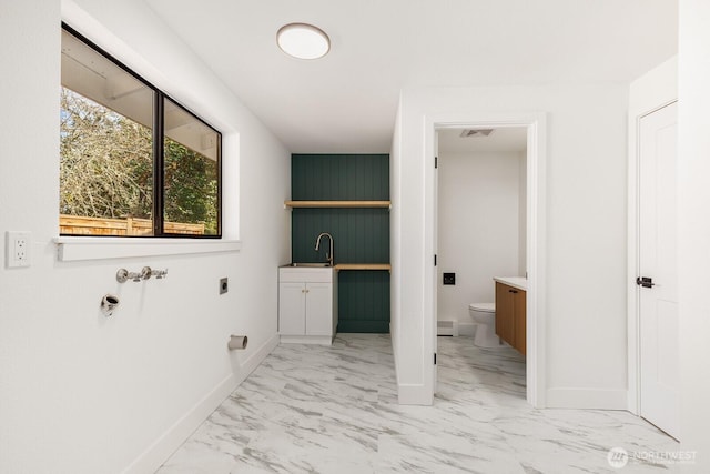 bathroom featuring baseboards, visible vents, toilet, marble finish floor, and vanity