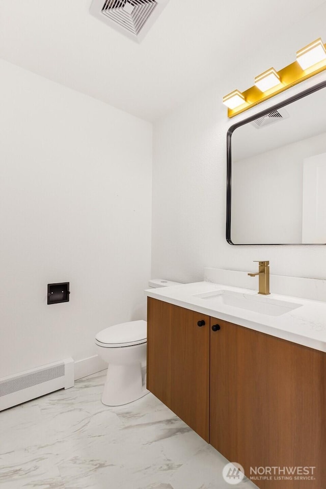 half bathroom featuring toilet, marble finish floor, a baseboard radiator, and visible vents