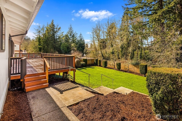 view of yard with a fenced backyard and a wooden deck