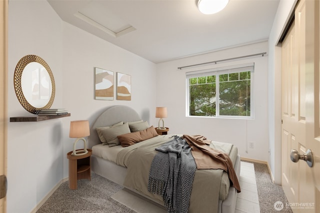 bedroom featuring carpet floors, attic access, and baseboards