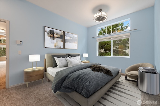 bedroom with carpet floors and baseboards