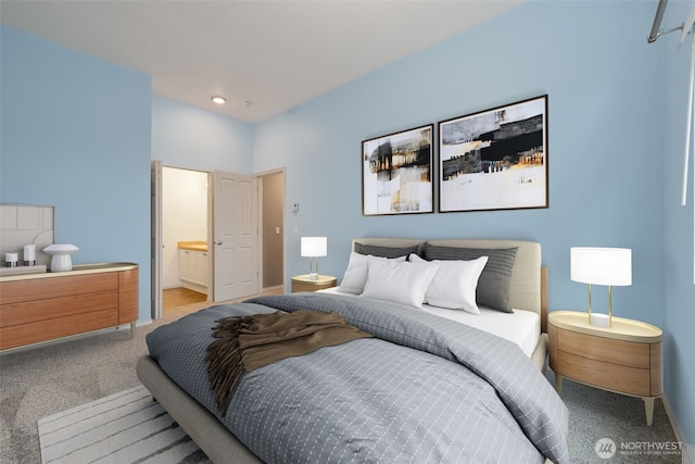 bedroom featuring carpet, baseboards, and connected bathroom