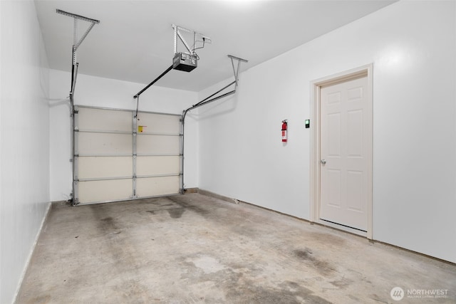 garage featuring a garage door opener