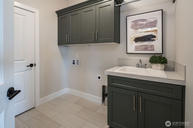 laundry room with hookup for a washing machine, hookup for an electric dryer, a sink, baseboards, and cabinet space