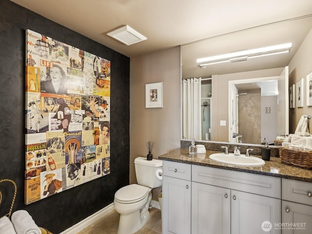 full bath with tile patterned flooring, curtained shower, toilet, and vanity