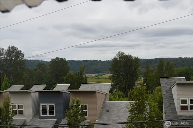 property view of mountains featuring a view of trees