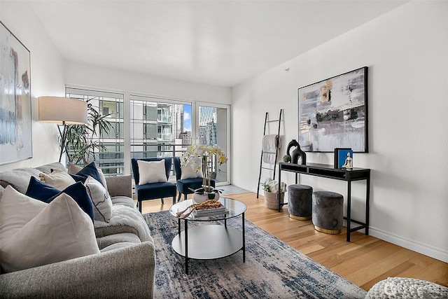 living room with wood finished floors and baseboards