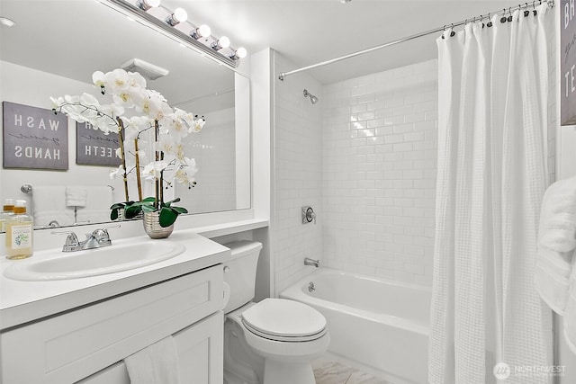 full bath featuring marble finish floor, vanity, shower / bath combo with shower curtain, and toilet