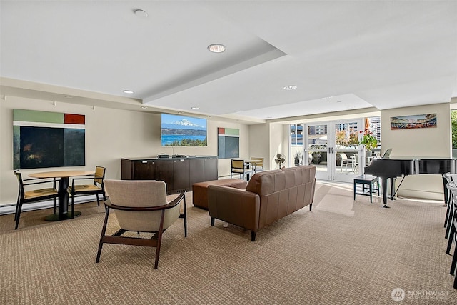 living room with carpet, french doors, a tray ceiling, and recessed lighting