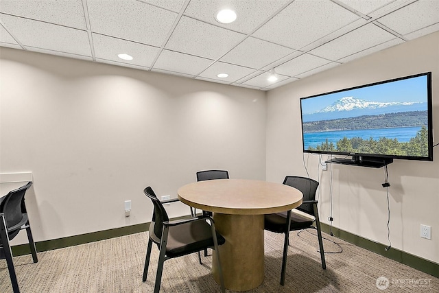 dining space with recessed lighting, a paneled ceiling, and baseboards