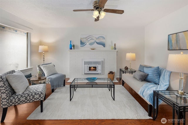 living area featuring ceiling fan and wood finished floors