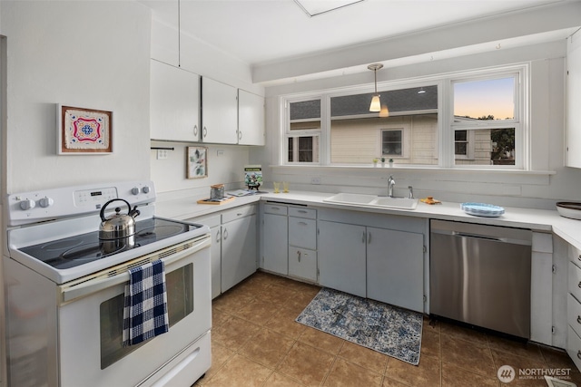 kitchen with a sink, light countertops, stainless steel dishwasher, gray cabinets, and white range with electric cooktop