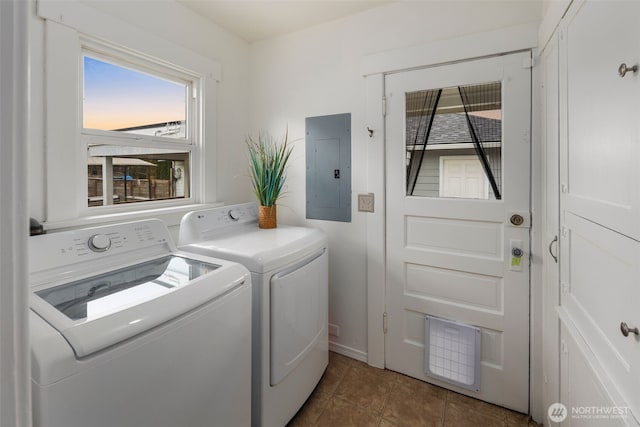 clothes washing area with tile patterned flooring, laundry area, electric panel, and washing machine and clothes dryer