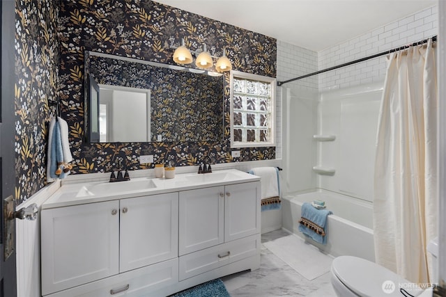 bathroom with shower / tub combo, a sink, toilet, and wallpapered walls