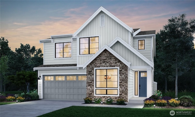 view of front of home with an attached garage, concrete driveway, board and batten siding, and stone siding