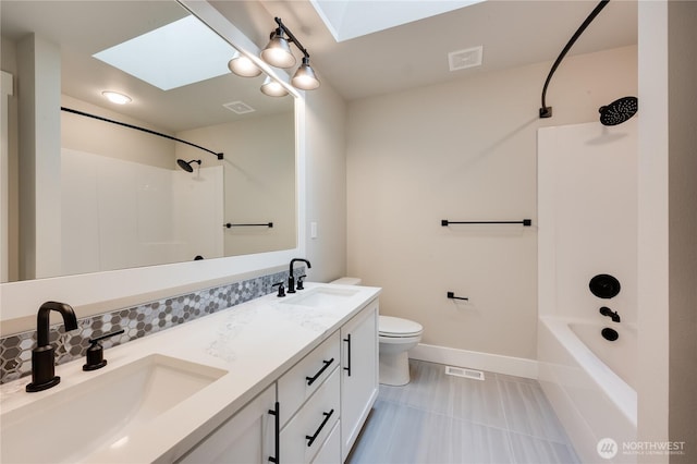 full bathroom with a skylight, a sink, and visible vents