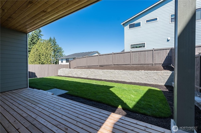 view of yard with a fenced backyard and a wooden deck