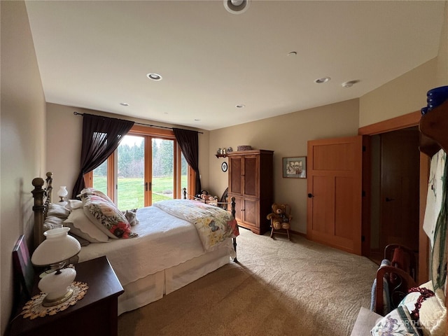 carpeted bedroom with recessed lighting and access to exterior