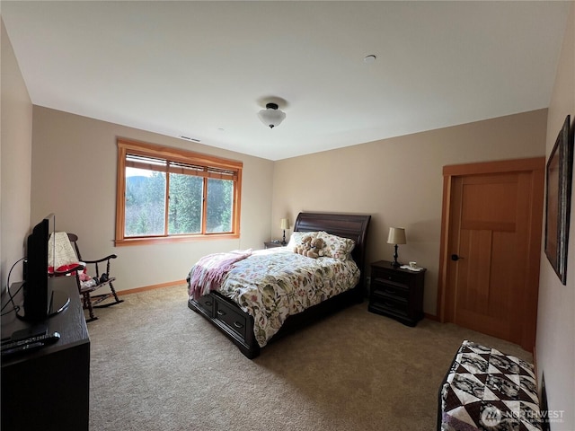 carpeted bedroom with baseboards and visible vents