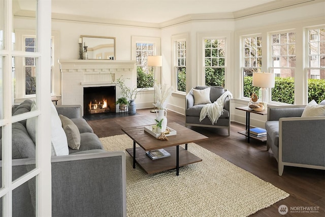 sunroom featuring a brick fireplace