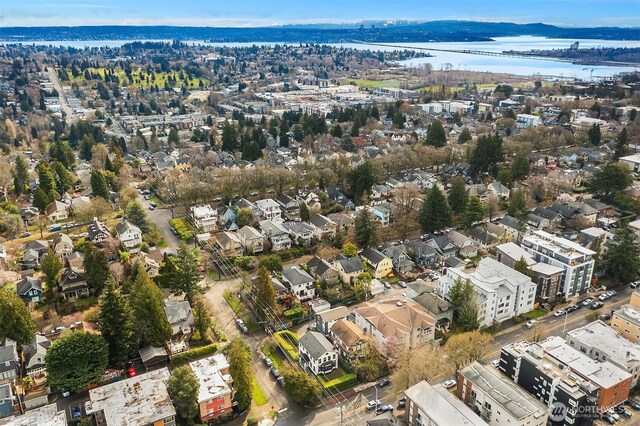 birds eye view of property featuring a water view