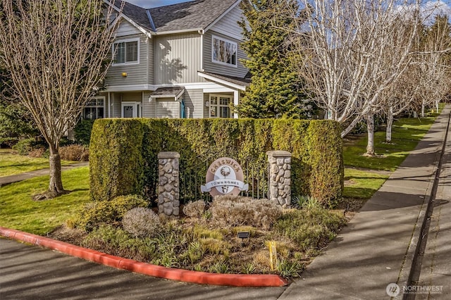 view of front of property with roof with shingles