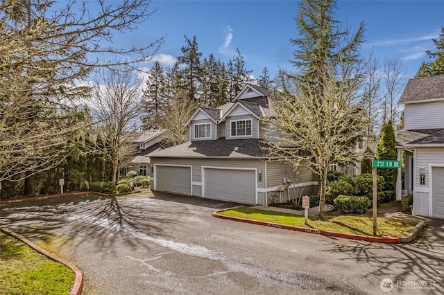 view of front of property featuring a garage and driveway