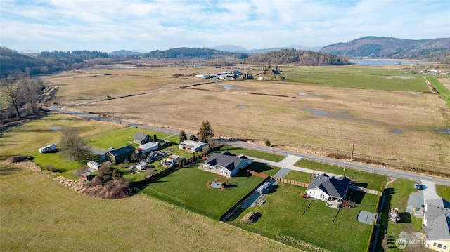 drone / aerial view with a mountain view and a rural view