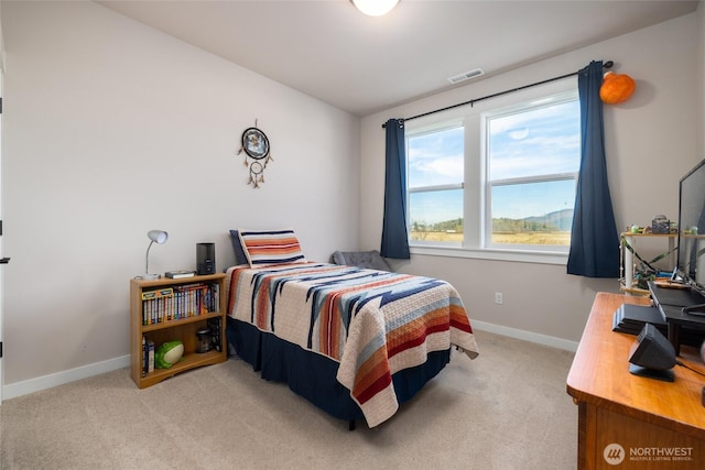 bedroom featuring carpet flooring, visible vents, and baseboards