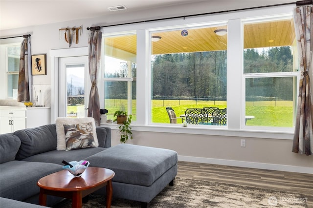 sunroom / solarium featuring a healthy amount of sunlight and visible vents