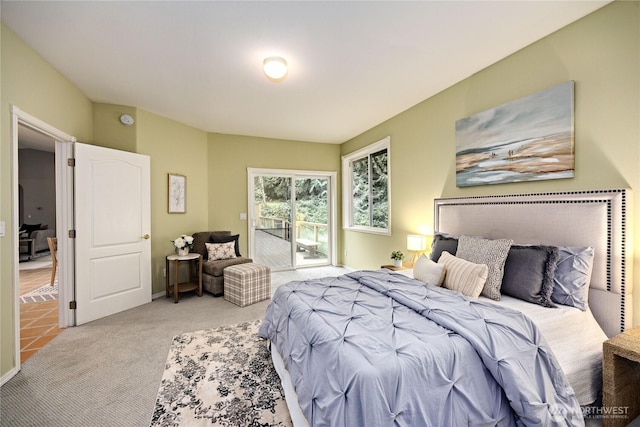 bedroom featuring carpet floors and access to outside