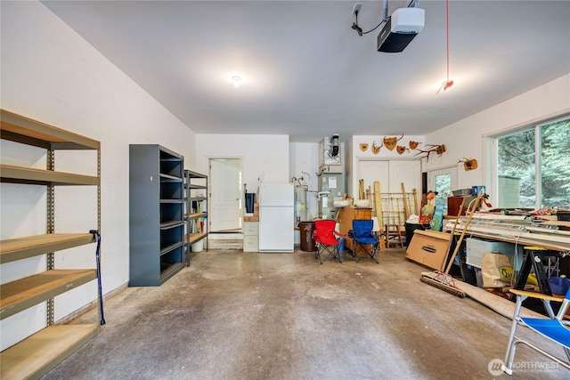 garage featuring a garage door opener and freestanding refrigerator