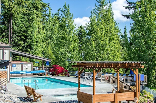 pool featuring a pergola and a patio