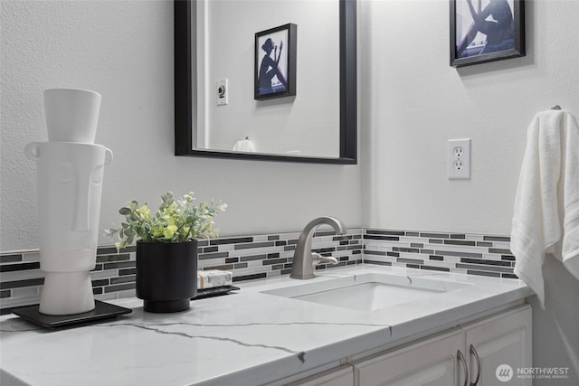 bathroom with backsplash and vanity