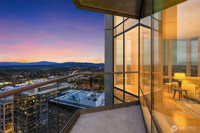 balcony with a city view and a mountain view