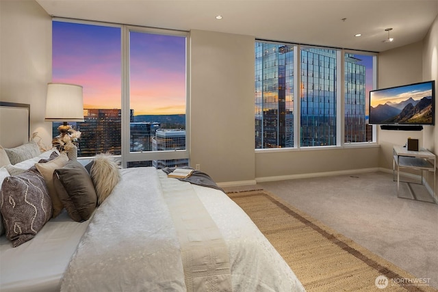 bedroom featuring carpet floors, recessed lighting, and baseboards