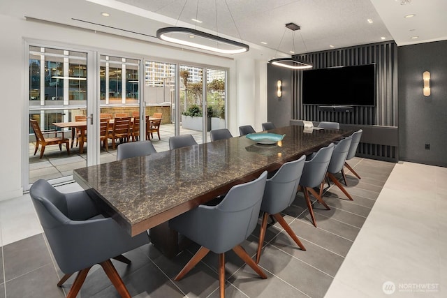 dining space featuring tile patterned floors and recessed lighting