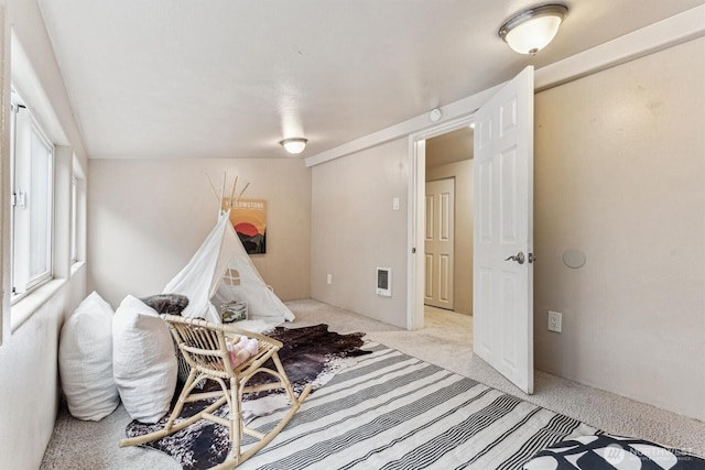 playroom with light carpet and visible vents