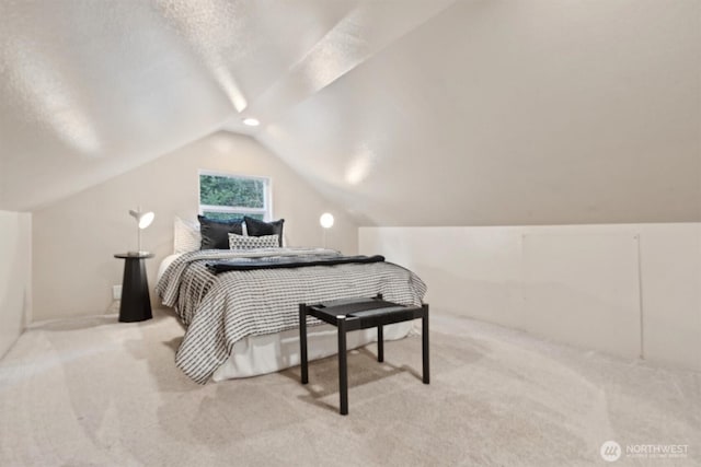 bedroom featuring vaulted ceiling and carpet flooring