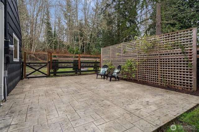 view of patio / terrace with a gate and fence