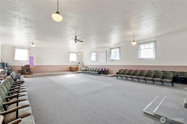 interior space featuring a wainscoted wall and wooden walls